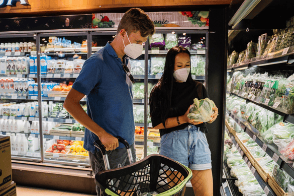 young couple buying food in the supermarket